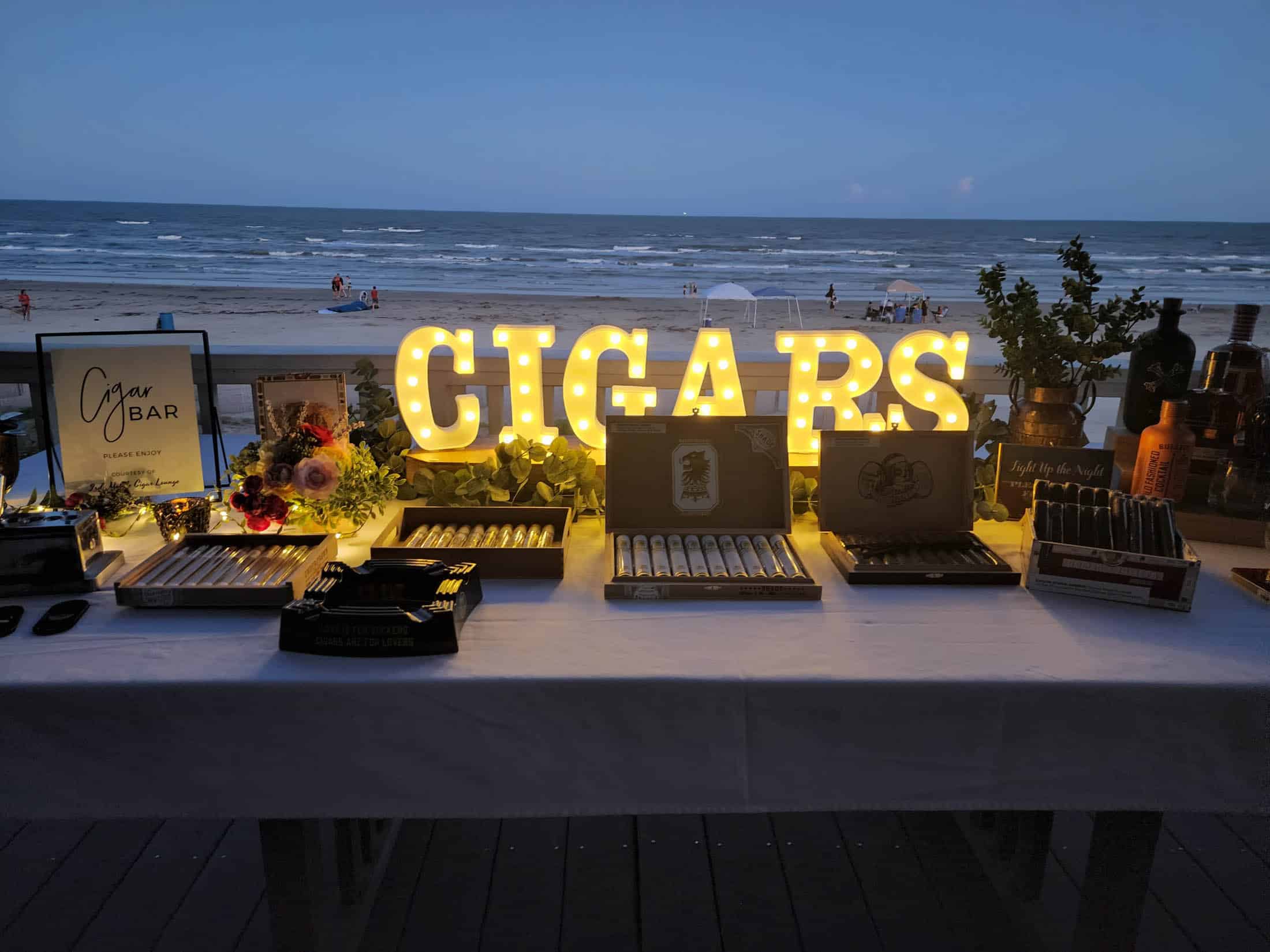 Decorative table showcasing 3rds Mobile Cigar Lounge setup.
